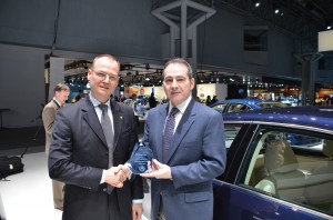 Rainer Michel of VW of America accepting the award from Jonathan Spira